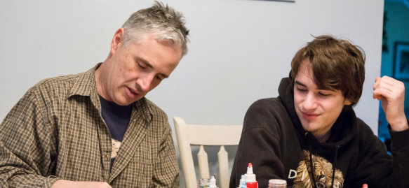 two people engaging in art activity