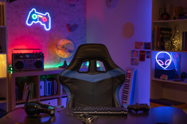 illuminated gaming setup with chair and neon lights