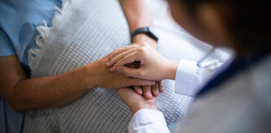 two person holding each others hands